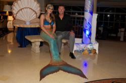 Robert Allenby poses with the mermaid at the Bluewater Golf Invitational.